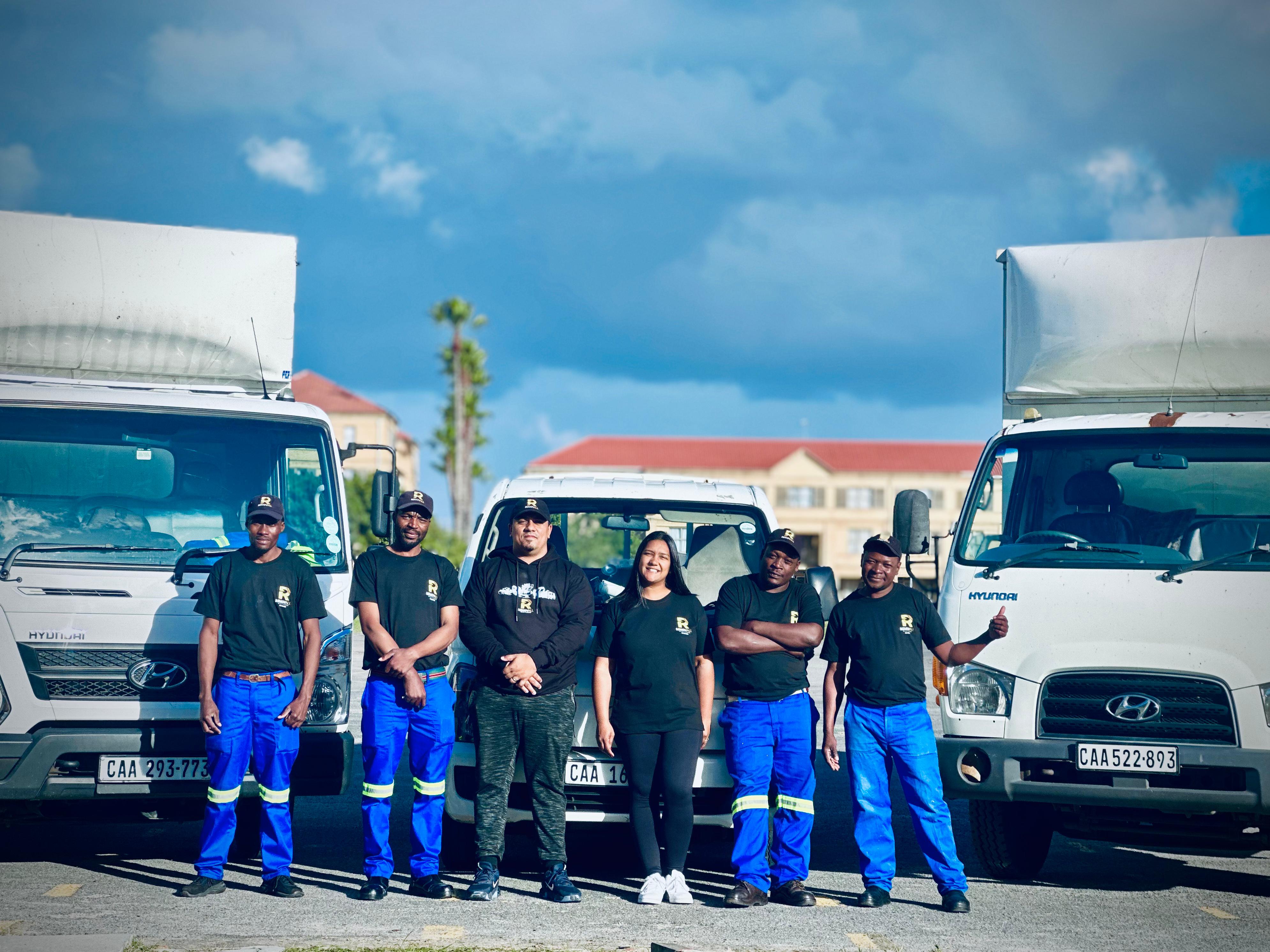 The RemovALL team standing with their fleet in Cape Town